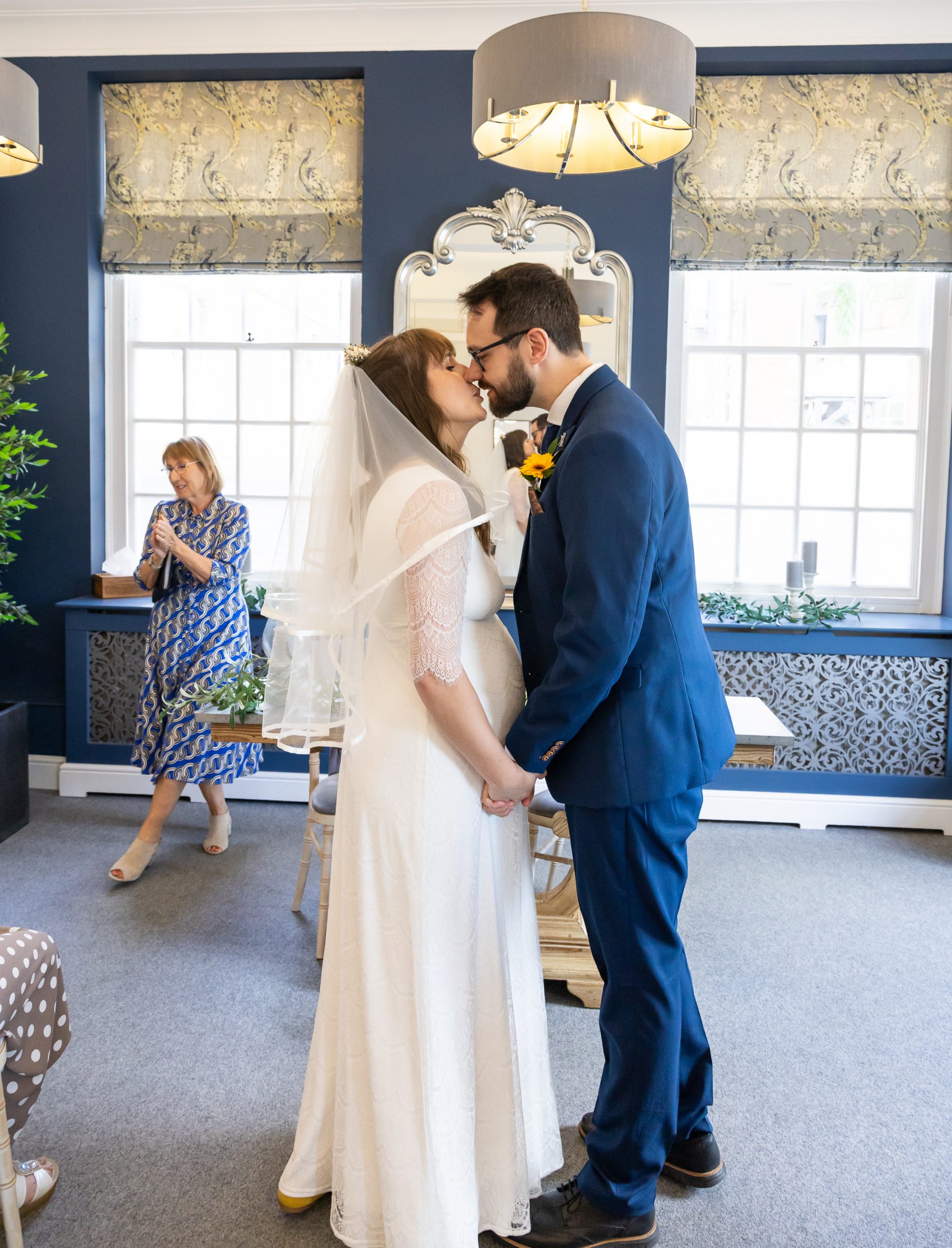 bride and groom share a kiss at Bury St Edmunds