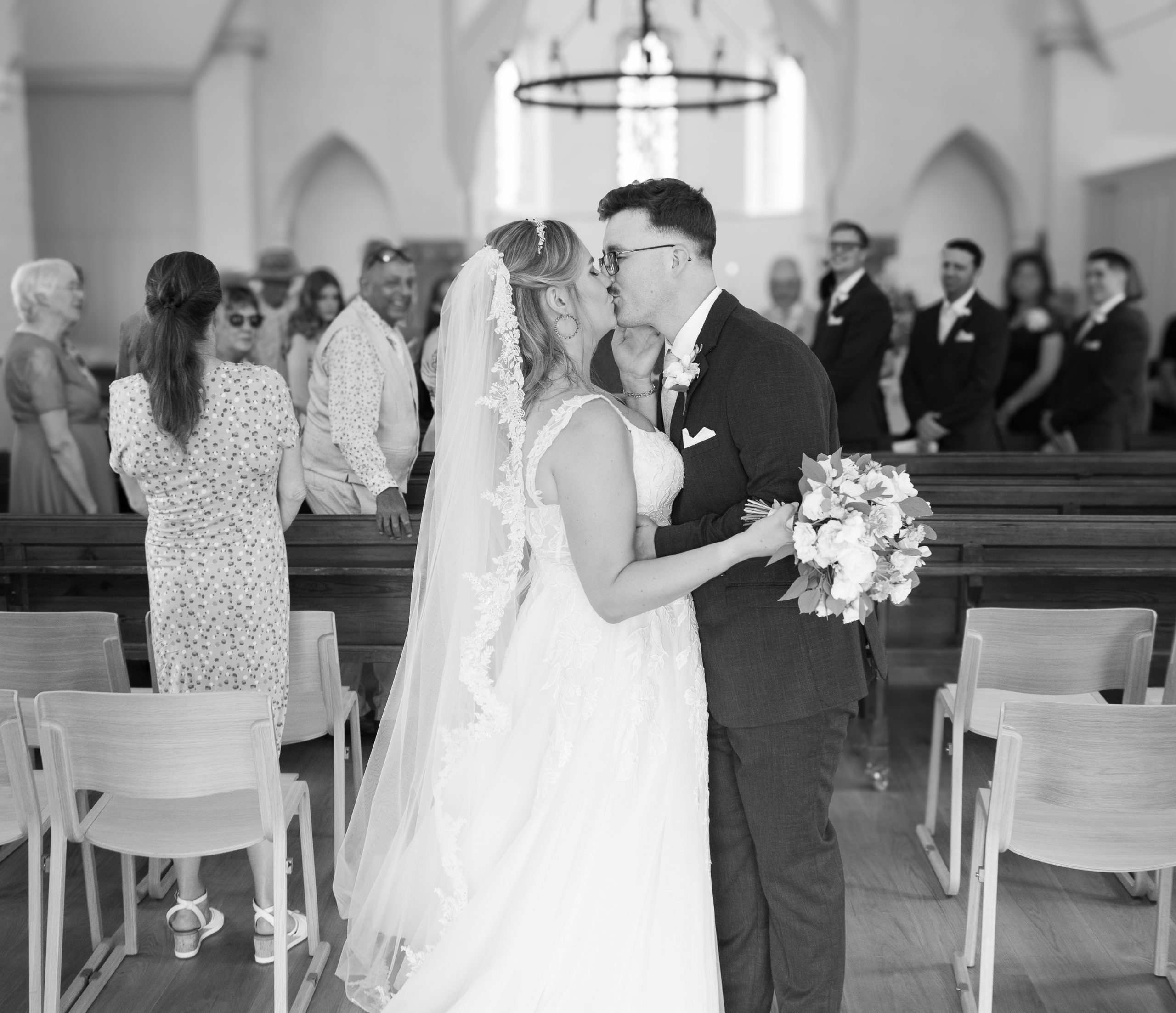 blossom-tree-wedding kiss the bride moment in Reach church