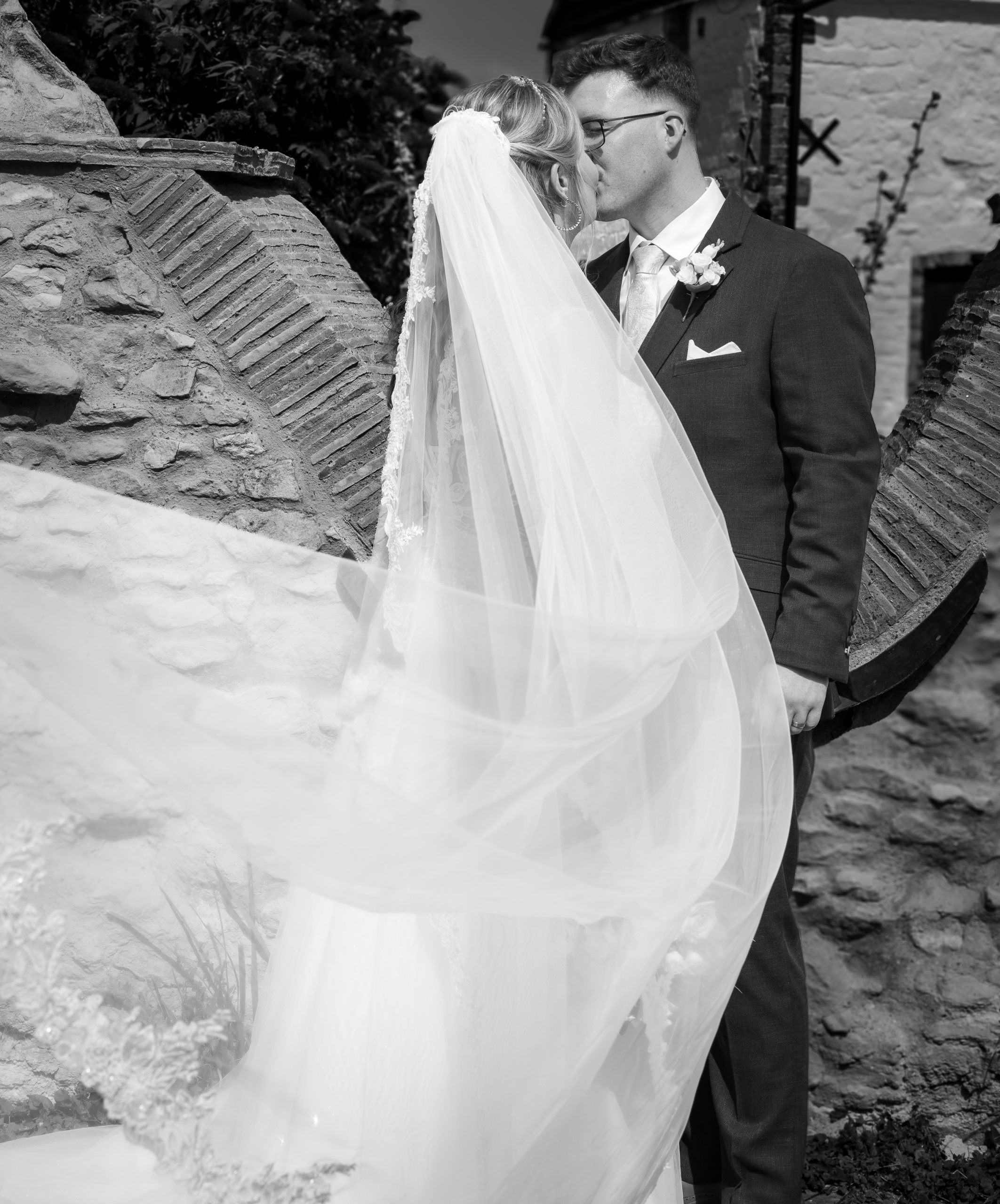 blossom-tree-wedding bride and groom sharing a kiss at Reach church