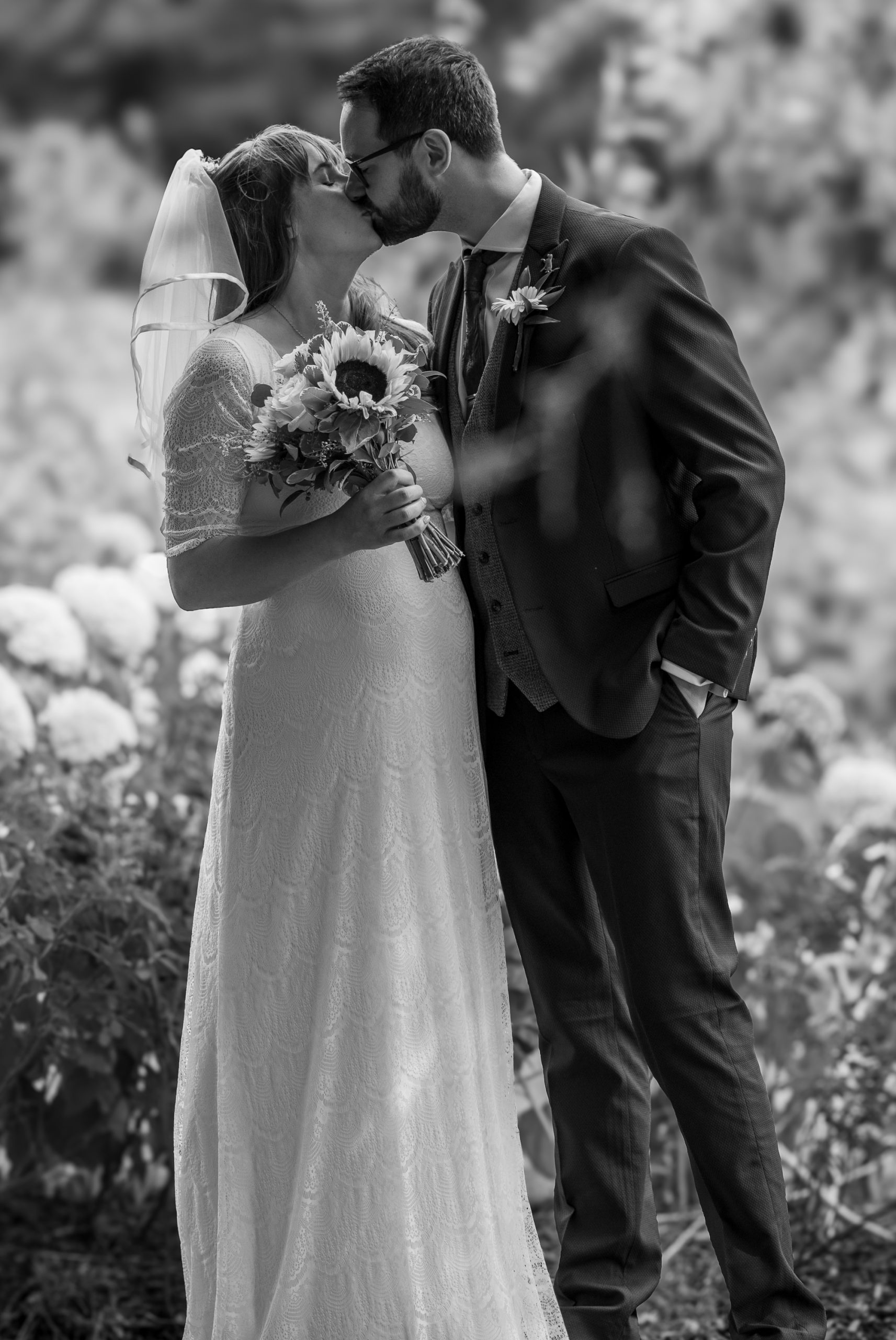bride and groom just married in Bury St Edmunds in Abbey gardens
